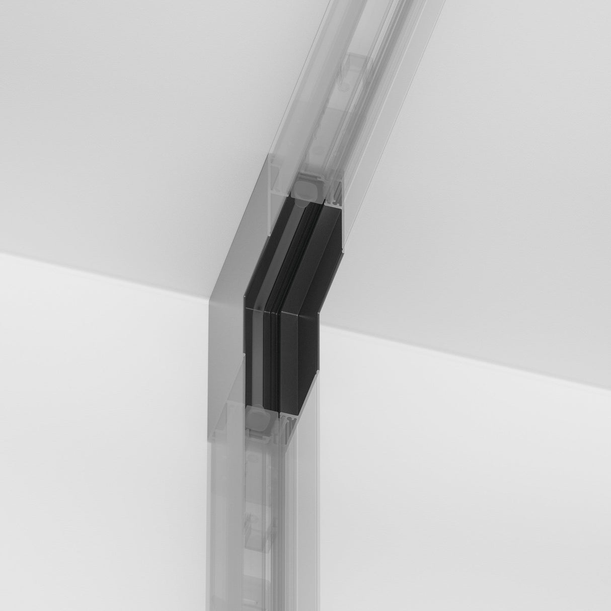 Close-up of a transparent frameless glass door hinge with a minimalist design and the S35 Magnetic Surface-Mounted Track Internal Corner Connector - Black between two glass panels, offering a seamless, modern look against a neutral background.