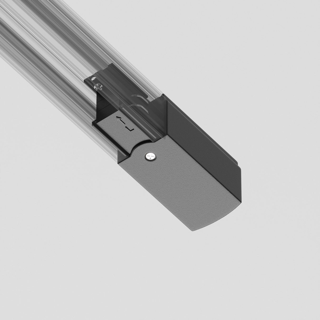 Close-up of the 3-Phase Track Trinity Left Power Input - Black, featuring a sleek rectangular sliding mechanism in black and silver with visible screws, against a plain gray background.