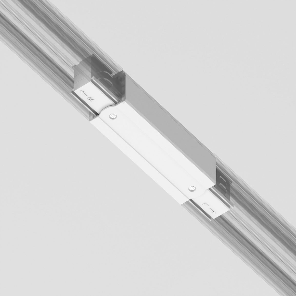 Close-up of a 3-Phase Surface-Mounted Track Trinity Straight Connector attached to a polished surface, featuring screws and a logo. The sleek, minimalistic design with white finish is complemented by strategic lighting configurations against a light background.