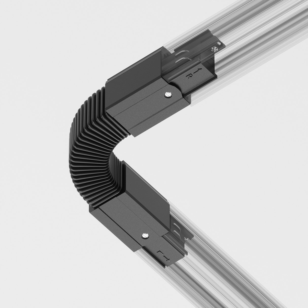 The 3-Phase Surface-Mounted Track Trinity Flexible Connector in black joins two silver articulated rails at a right angle with its ribbed, metallic design, perfect for modern interiors. The grooved rails are secured with black clips against a simple white backdrop.