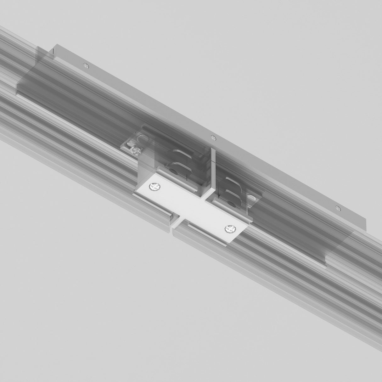 A close-up image shows the white 3-Phase Surface-Mounted Track Trinity Internal Straight Connector attached to a horizontal track in a lighting system. Visible screws secure the rectangular connector, seamlessly bridging two rail sections against a neutral gray background.