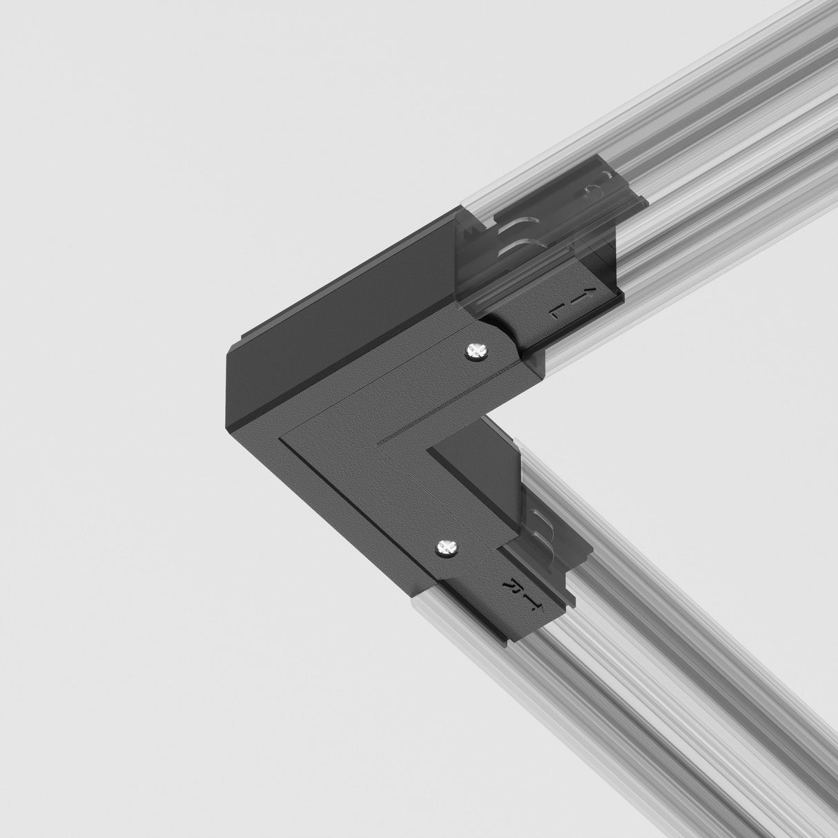 A close-up showcases a black 3-Phase Surface-Mounted Track Trinity Left Corner Connector securing two aluminum beams at a right angle. This L-shaped bracket, used in track lighting systems, is fastened with screws against a plain light-colored background.