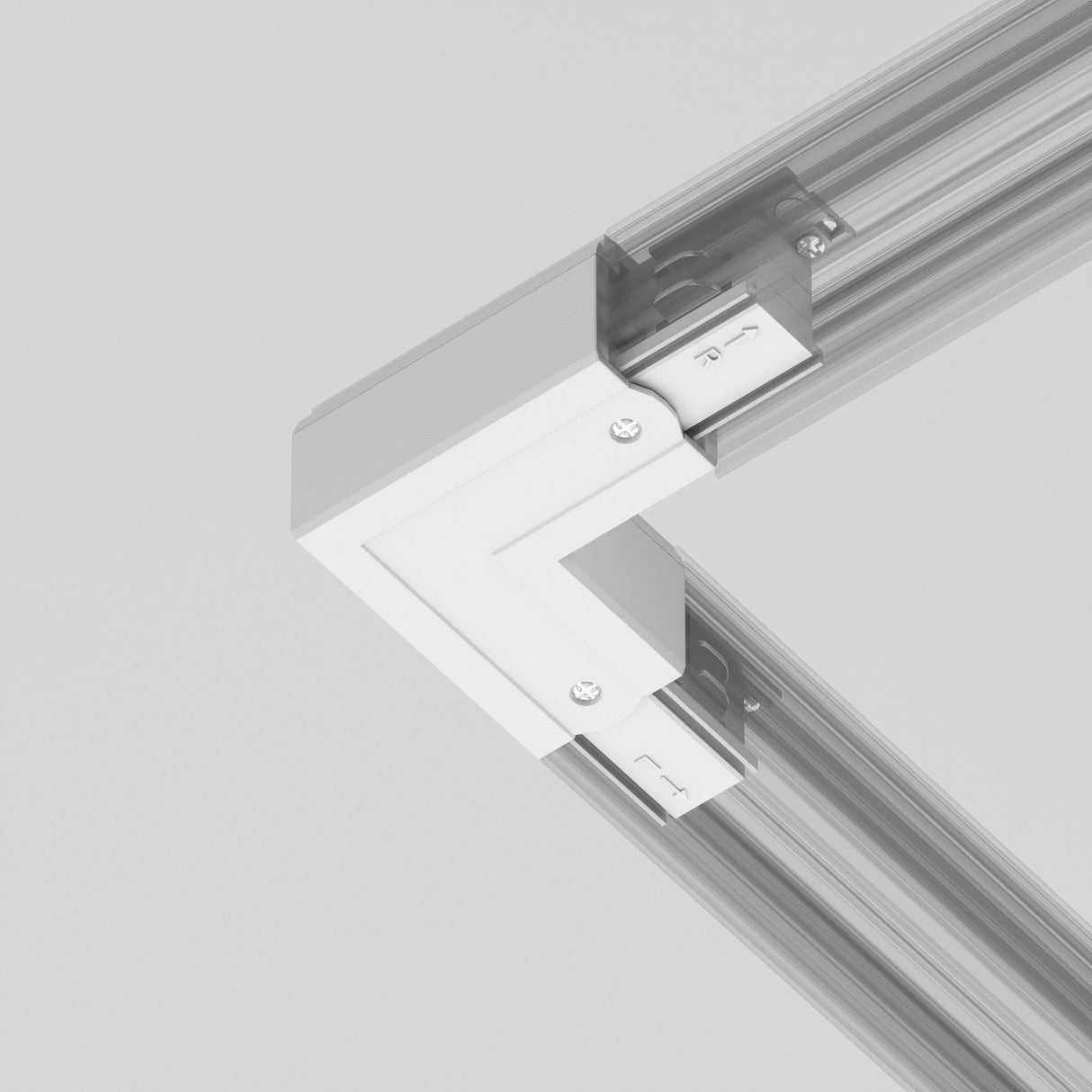The 3-Phase Surface-Mounted Track Trinity Right Corner Connector - White is shown with screws, linking two perpendicular metal rails for industrial or architectural use, against a neutral background.