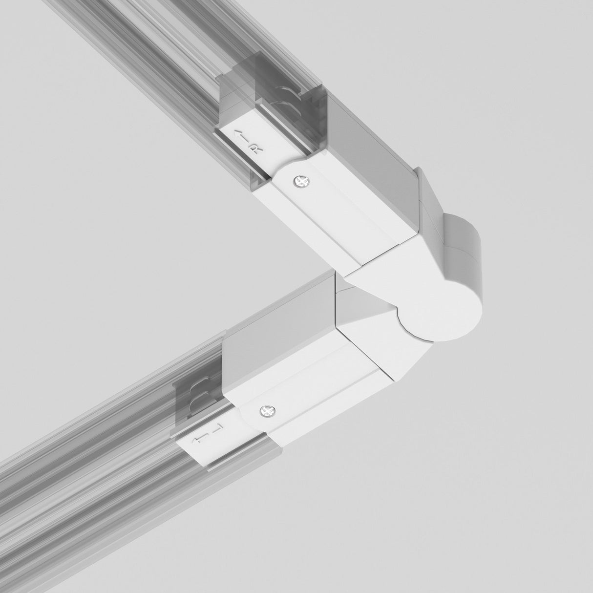 Close-up of a sleek, white, L-shaped 3-Phase Surface-Mounted Track Trinity Swivel Connector linking two beams on a gray background. Its modern design with visible screws and alignment markers is perfect for track lighting in contemporary settings.