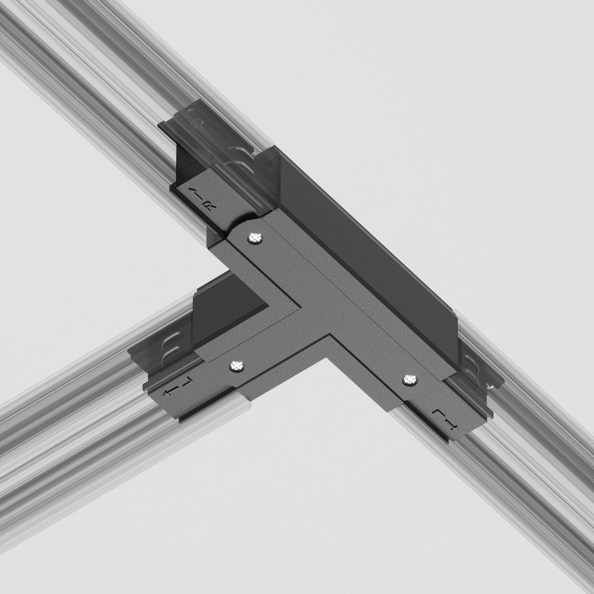 The 3-Phase Surface-Mounted Track Trinity Left T-Shaped Connector in black comes with screws and aligns seamlessly with metal rails on a white background, featuring directional arrows and small brackets to enhance its modern look for track lighting systems.