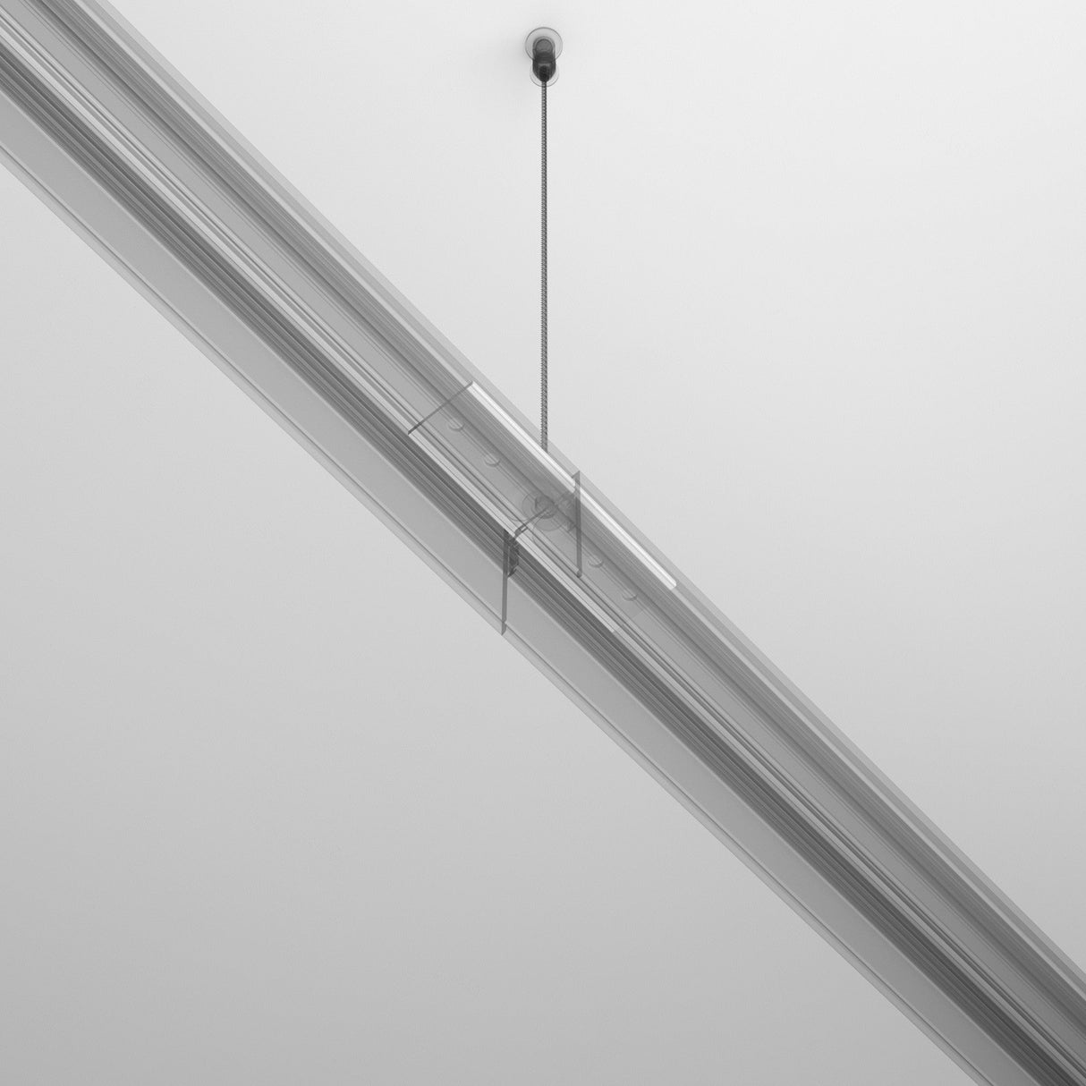 A minimalist image showcases the Exility Magnetic Surface-Mounted Track Straight Connector - White on a white ceiling. Its sleek and modern design hangs from a single cable, effortlessly blending with the plain background.