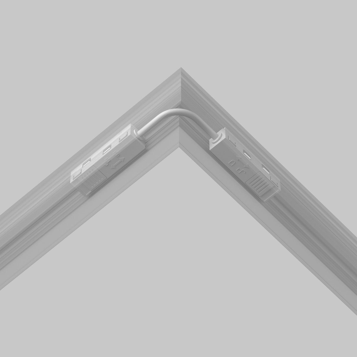 The Exility Track Flexible Corner Power Connector 15cm - White features a close-up of two metal tracks connected by a cable. Its grooved, clipped design suggests a modular system for track lighting, and the monochrome image enhances its sleek appearance.