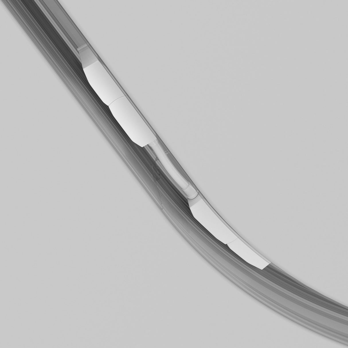 Close-up of the Exility Magnetic Recessed Track Corner Oval Connector in white against a light gray background. Its modern, sleek, curved metal edge boasts a shiny and reflective surface, enhancing the minimalist and elegant design.