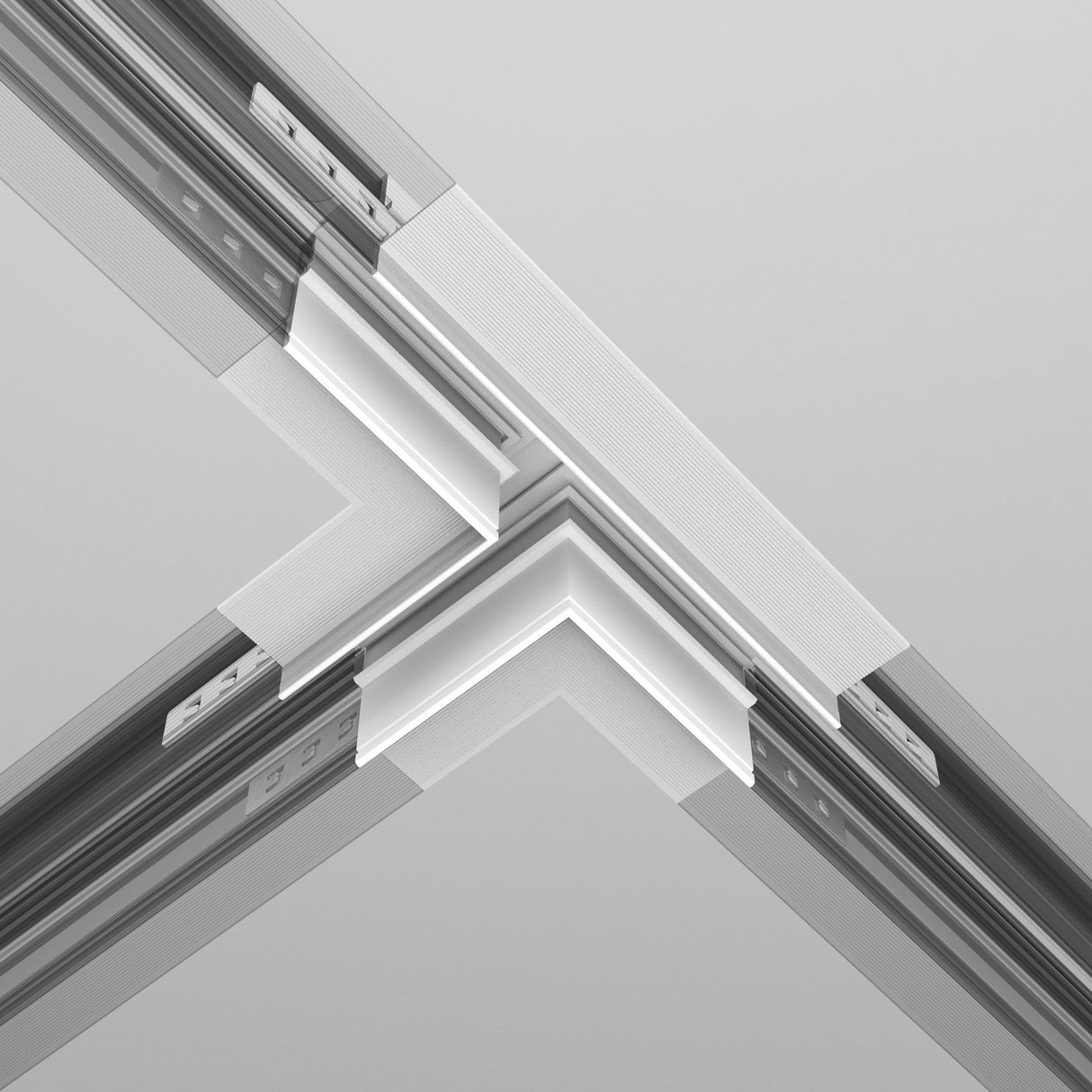 A close-up view showcases a modern ceiling with intersecting metallic and white panels, incorporating the Exility Tracks T-Connector Built-in For Plasterboard 12.5mm - White. These sleek panels form a geometric pattern that enhances the minimalist and industrial design with integrated track lighting.