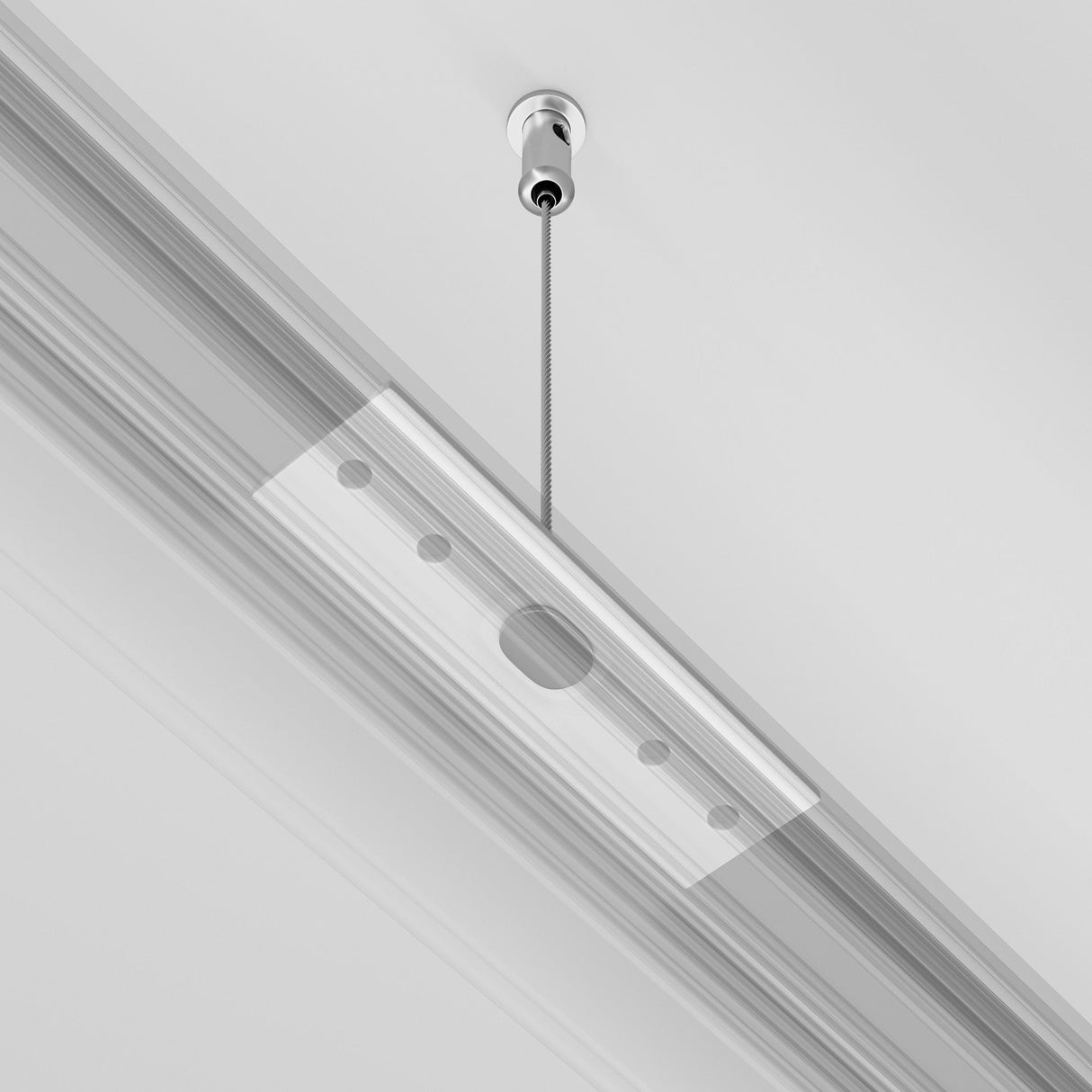 The Exility Magnetic Surface-Mounted Track Suspension Cable showcases a sleek rectangular design with a minimalist white finish, featuring a central circular hole and multiple smaller cutouts, embodying cutting-edge modern lighting style.