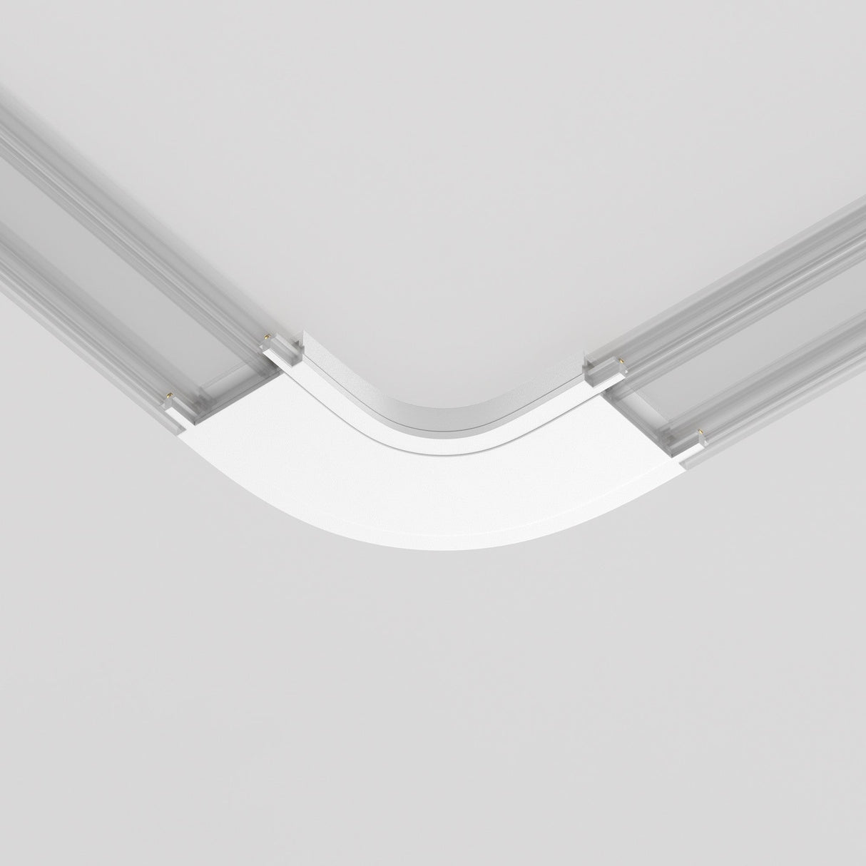 A minimalist ceiling design features a smooth, curved Radity Magnetic Track Curved Power Connector in matte white, creating a modern architectural aesthetic even with the lighting off.