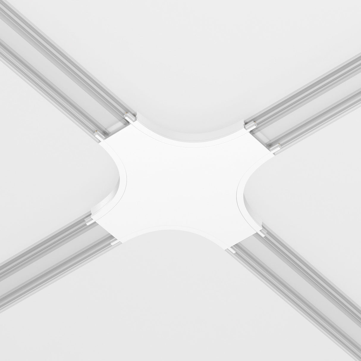 A ceiling view highlights a modern intersection of four linear lights, each extending from the central Radity Magnetic Track X-Shaped Power Connector in white, seamlessly integrated into a sleek magnetic track system against a pristine white background.