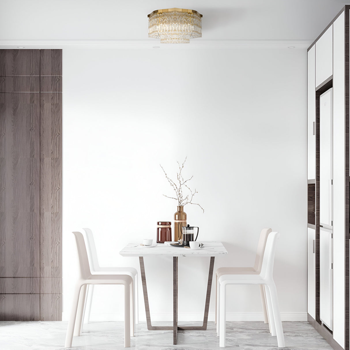 Minimalist dining area featuring a small white table and two chairs. A vase with branches and stacked cup adorn the table. Above, the Dune 6 Light Flush - Gold & Crystal provides elegance, while light wood accents enhance the beautiful space.
.