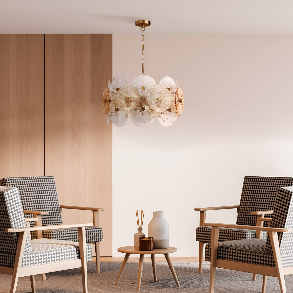 A modern living room features two check-patterned armchairs, a small round wooden table, and decorative vases. The elegant Aster 8 Light Chandelier - Gold complements the light wood paneling and carpeted floor, enhancing the rooms contemporary aesthetics.