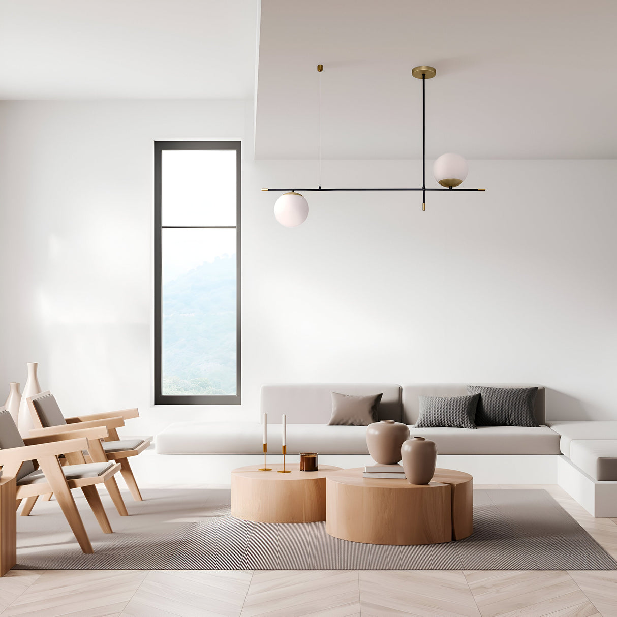 The minimalist living room showcases modern elegance with light wood furniture, a gray-cushioned sectional sofa, and two round wooden tables with decor. A Nostalgia 2 Light Suspension - Black With Gold hangs gracefully, while a tall window bathes the neutral-toned space in natural light.