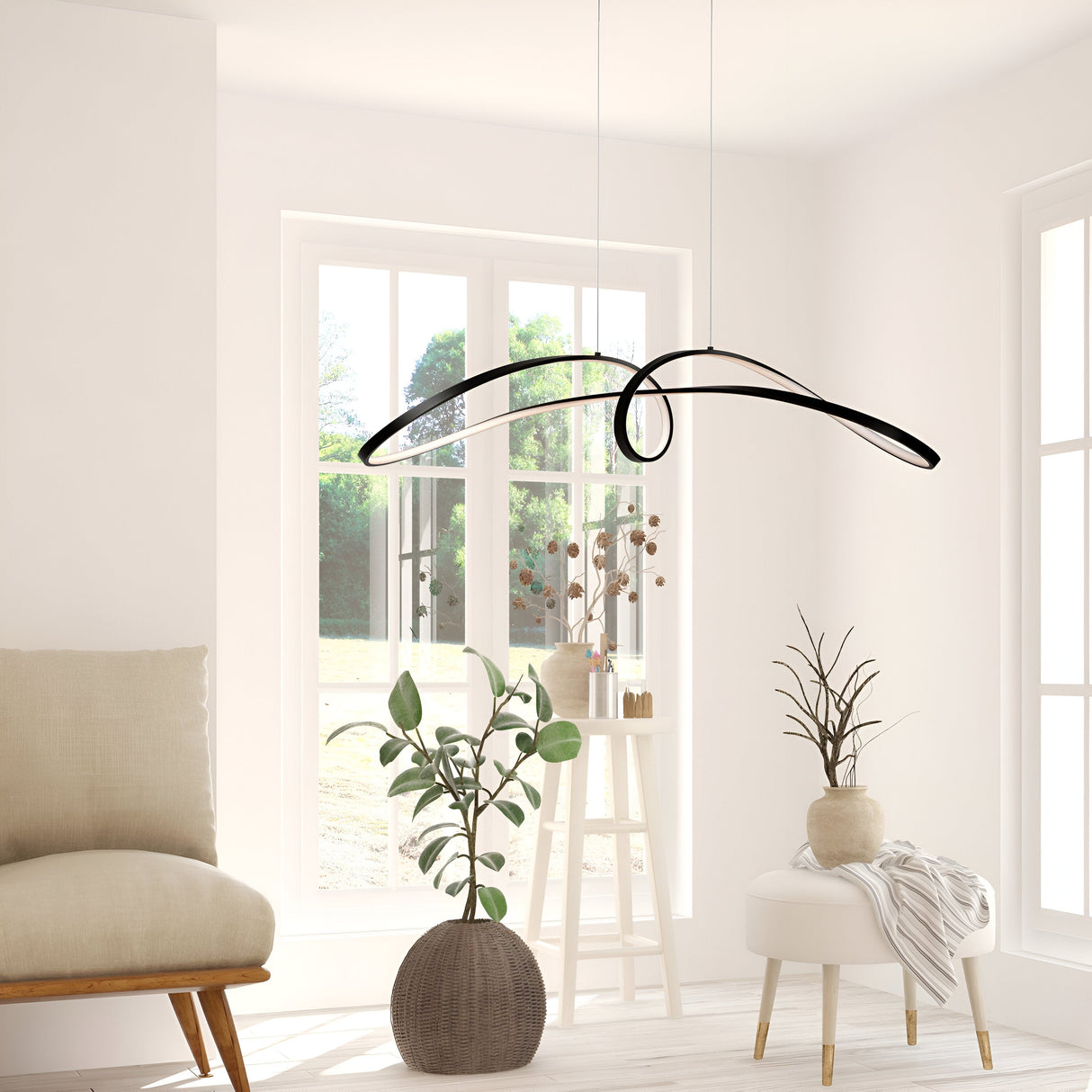 A minimalist room with large windows, light walls, and a Curve LED Loop Suspension Light - Black as the centerpiece. It includes a cushiony chair, potted plants, and a wooden stool adorned with a vase and decorative branches.