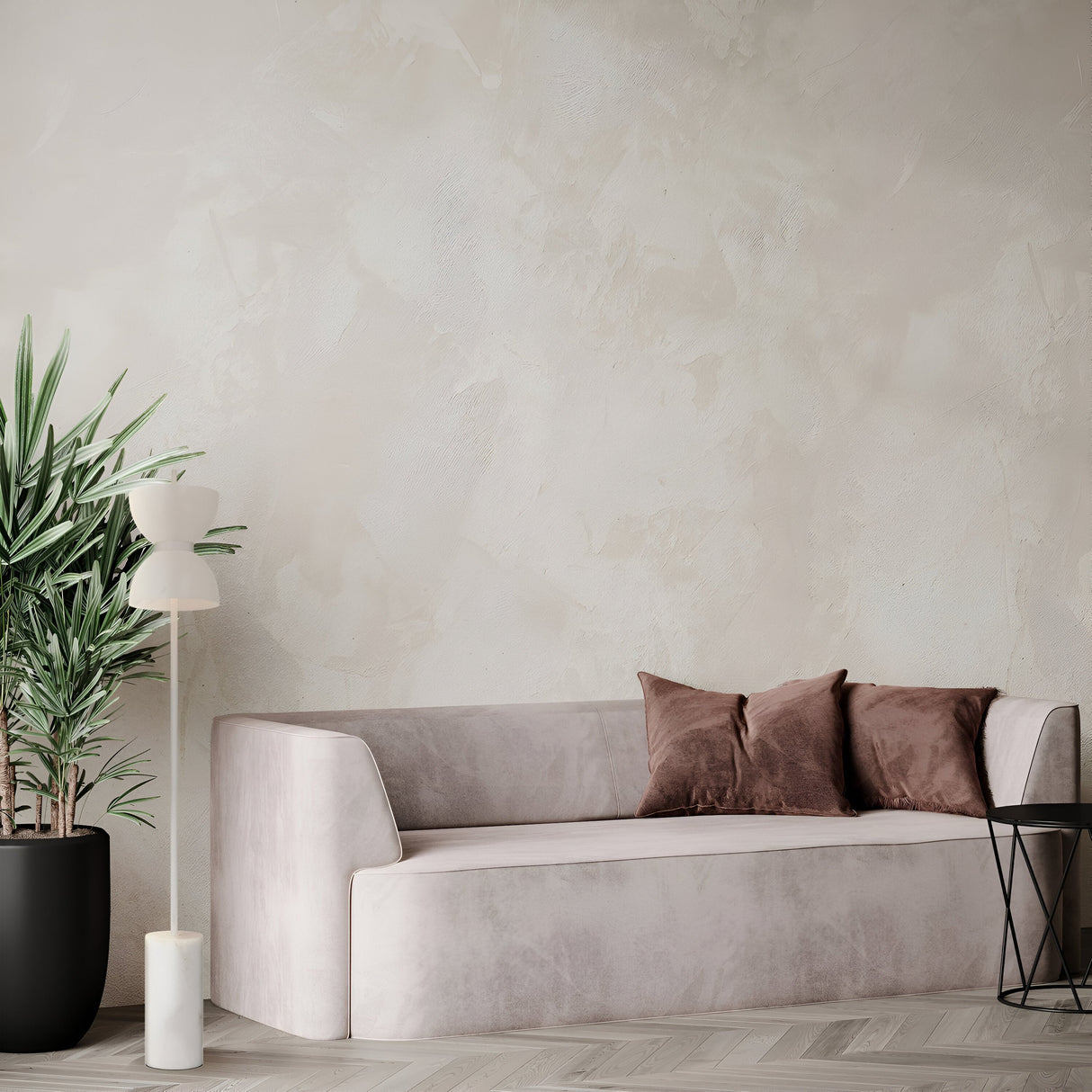 A minimalist living room showcases a light gray sofa with two brown cushions, complemented by the Kyoto LED Floor Lamp in white. A potted plant adds a fresh touch, and the look is completed with textured walls and a herringbone floor for serene elegance.