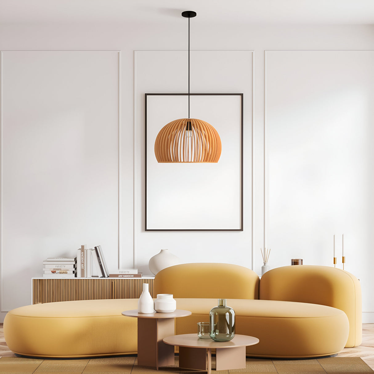 A minimalist living room showcases a mustard-yellow curved sofa and a small wooden coffee table with decorative vases. A Roots Pendant Light 45cm - Black With Beige Wooden Half-Dome Shade enhances the elegance, while framed artwork adorns the white paneled wall, complemented by natural wood flooring.