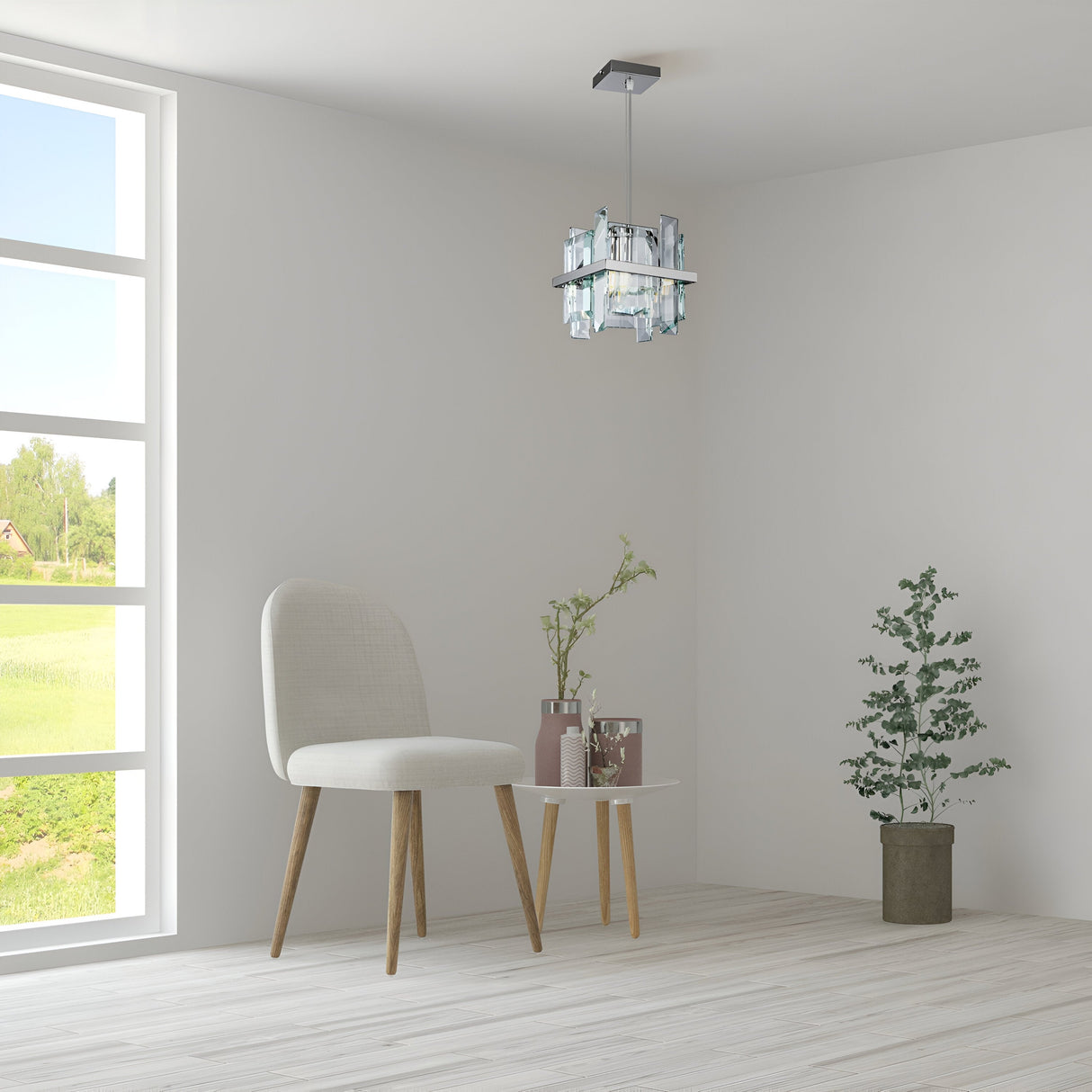 A minimalist room features a white chair beside a round table with vases. The Cerezo Single Glass Pendant Light - Chrome hangs from the ceiling, creating sleek lighting. A potted plant rests on the wooden floor, and a large window displays a grassy landscape outside.