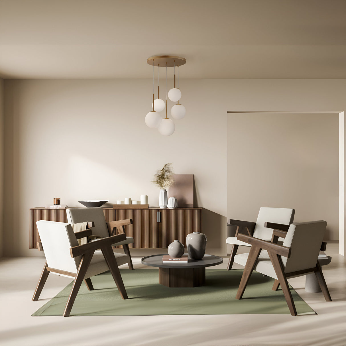 A modern, minimalist living room features two wooden armchairs and a loveseat around a round coffee table. A sideboard displays decor items beneath the Basic form 5 Light Cluster Pendant (Gold with White Opal Glass), casting soft light that enhances the cozy neutral tones.