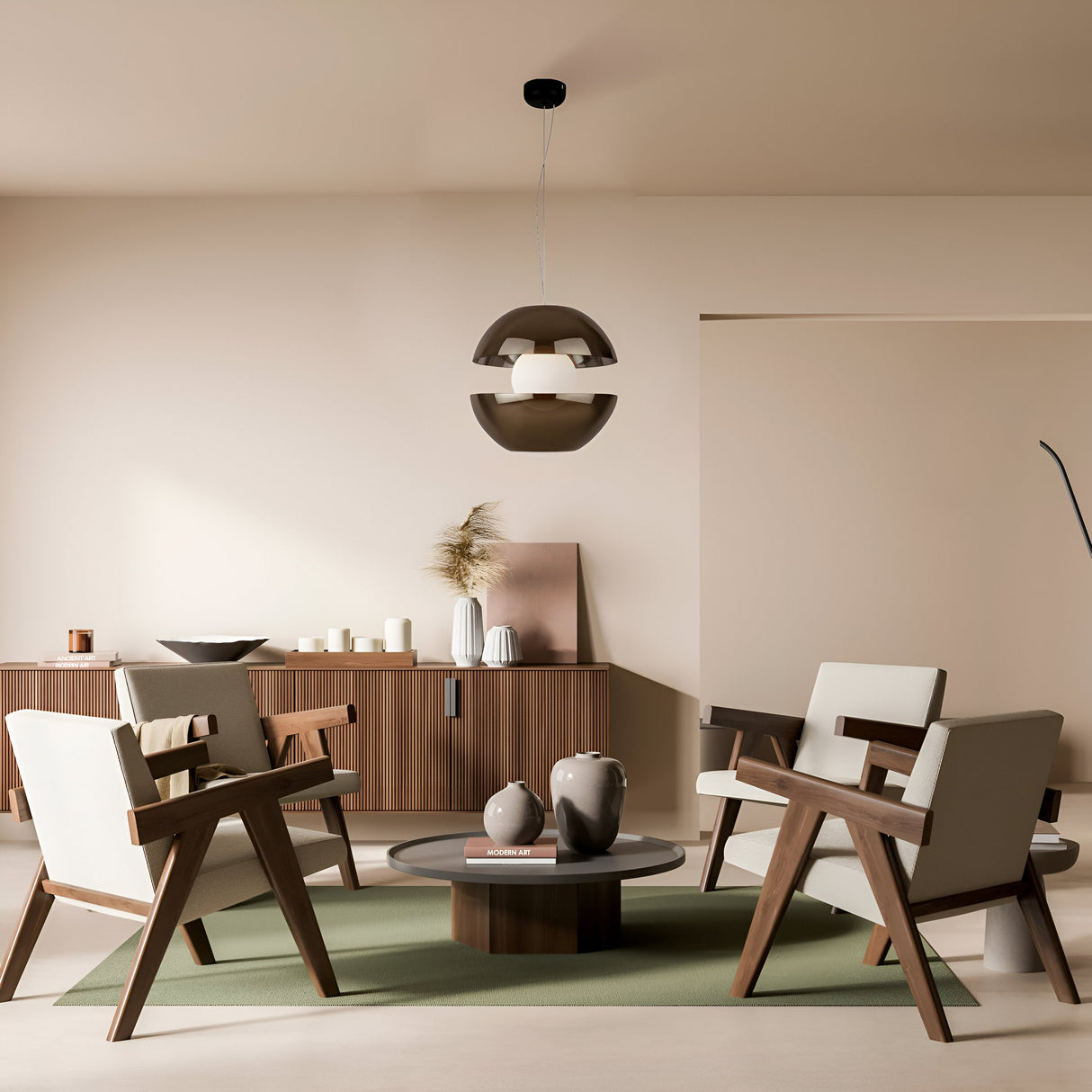 In a modern living room, four wooden armchairs encircle a round coffee table on a green rug. Above, the Rebel LED Glass Pendant Light - Gold shines with energy-efficient warmth. Neutral walls and flooring anchor the space, while vases and candles adorn a sideboard.