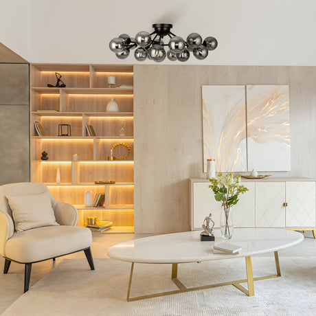 The modern living room showcases a Dallas 20 Light Semi-Flush in black with smoked glass, an oval coffee table with gold legs, and a beige armchair. Backlit wooden shelves complement abstract art above a white sideboard, enhanced by flowers and decorative items.