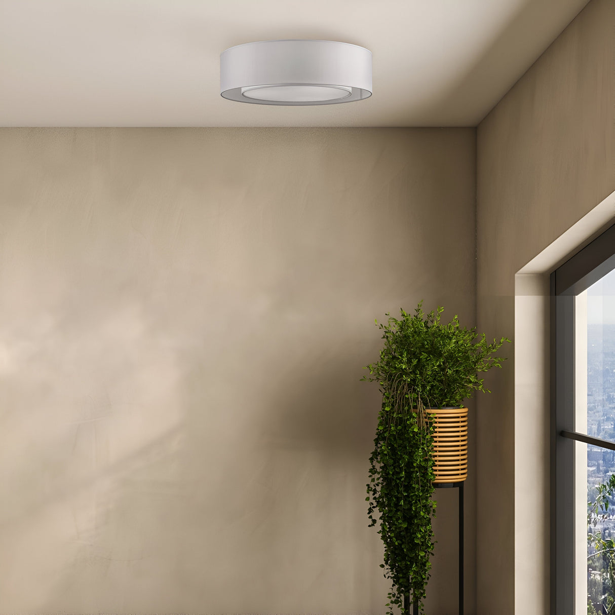 The Bergamo 3 Light Flush - Chrome With White & Grey Shade enhances a minimalist room with beige walls. A tall plant in a wooden planter is beside a large chrome-framed window, showcasing the cityscape beneath a clear sky.