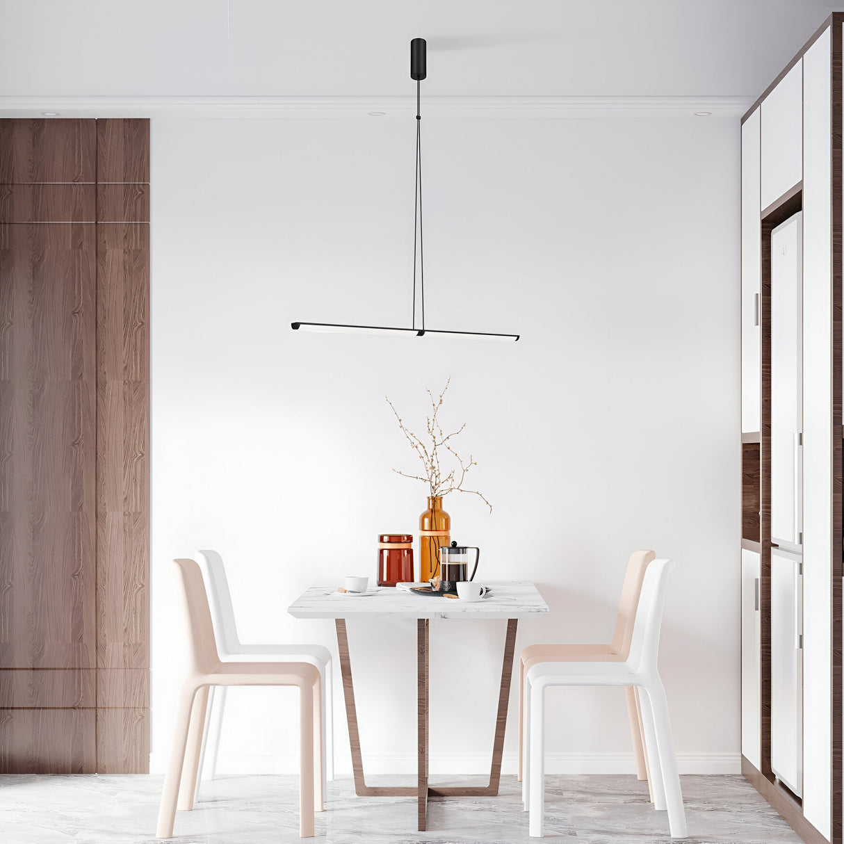 A minimalist dining area with a small table and two beige chairs against a white wall features the Supersymmetry Dimmable LED Pendant Light 18W 4000K - Black, casting an elegant glow. The table displays a vase with branches, coffee mugs, and a jug, while wood accents add warmth to the modern setting.