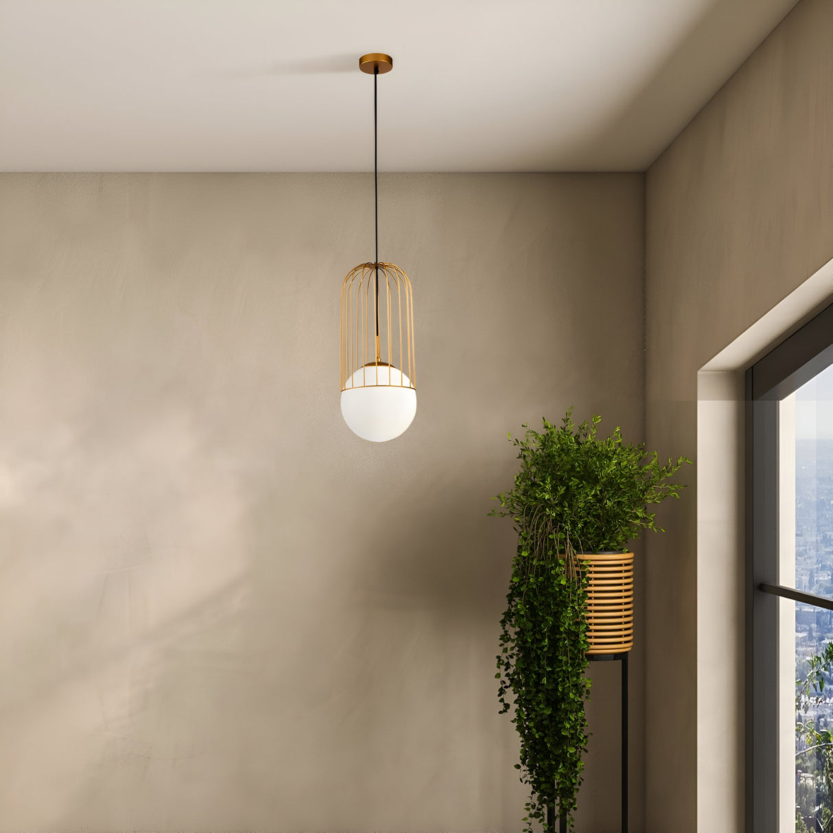 A Telford Pendant Light - Gold With Large White Glass hangs from the ceiling on a long black cord. A lush green plant in a tall, striped pot sits by a large window showing an urban cityscape outside, with walls painted in a neutral tone.