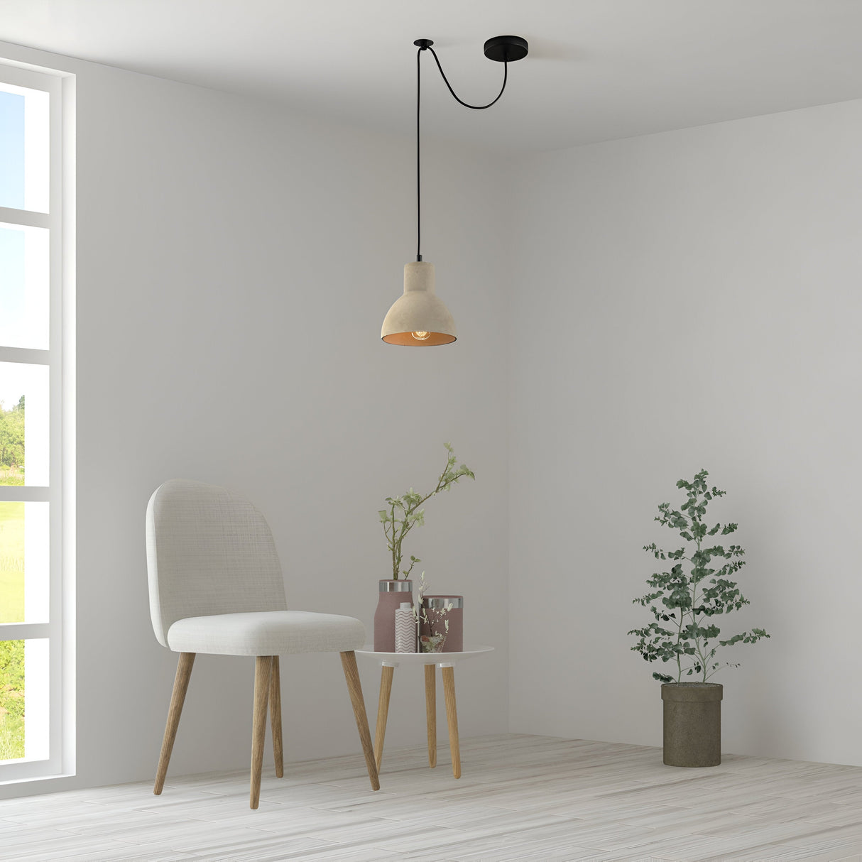 A minimalist room combines modern and industrial styles, featuring a round table with vases and glass. A cushioned chair with wooden legs sits by a potted plant, under the Broni Pendant Light 16cm in Black with Grey Concrete Shade, as natural light illuminates the pale wooden floor and white walls.