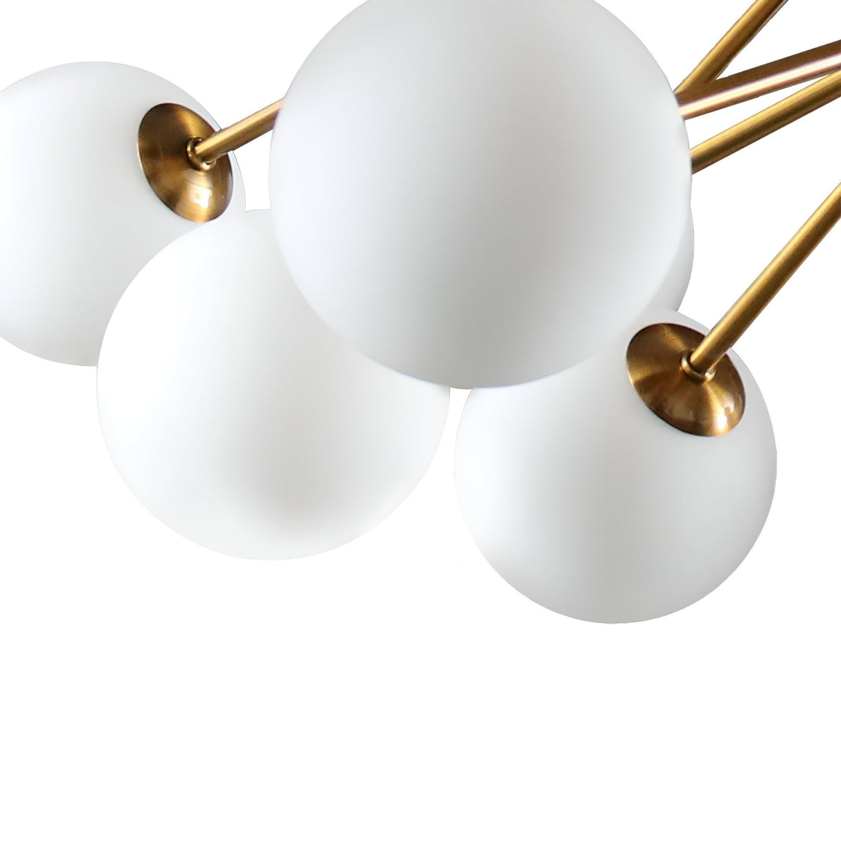 Close-up of four opal glass shades with a brass finish, featured on the elegant Ivy 18 Light Chandelier - Brass, against a white background.