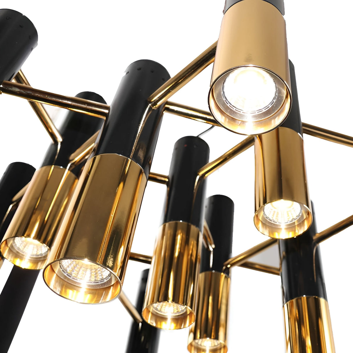 Close-up view of the Leonard 19 Light LED Chandelier in black and gold, showcasing cylindrical fixtures illuminated in a geometric pattern—a striking, energy-efficient example of modern design.