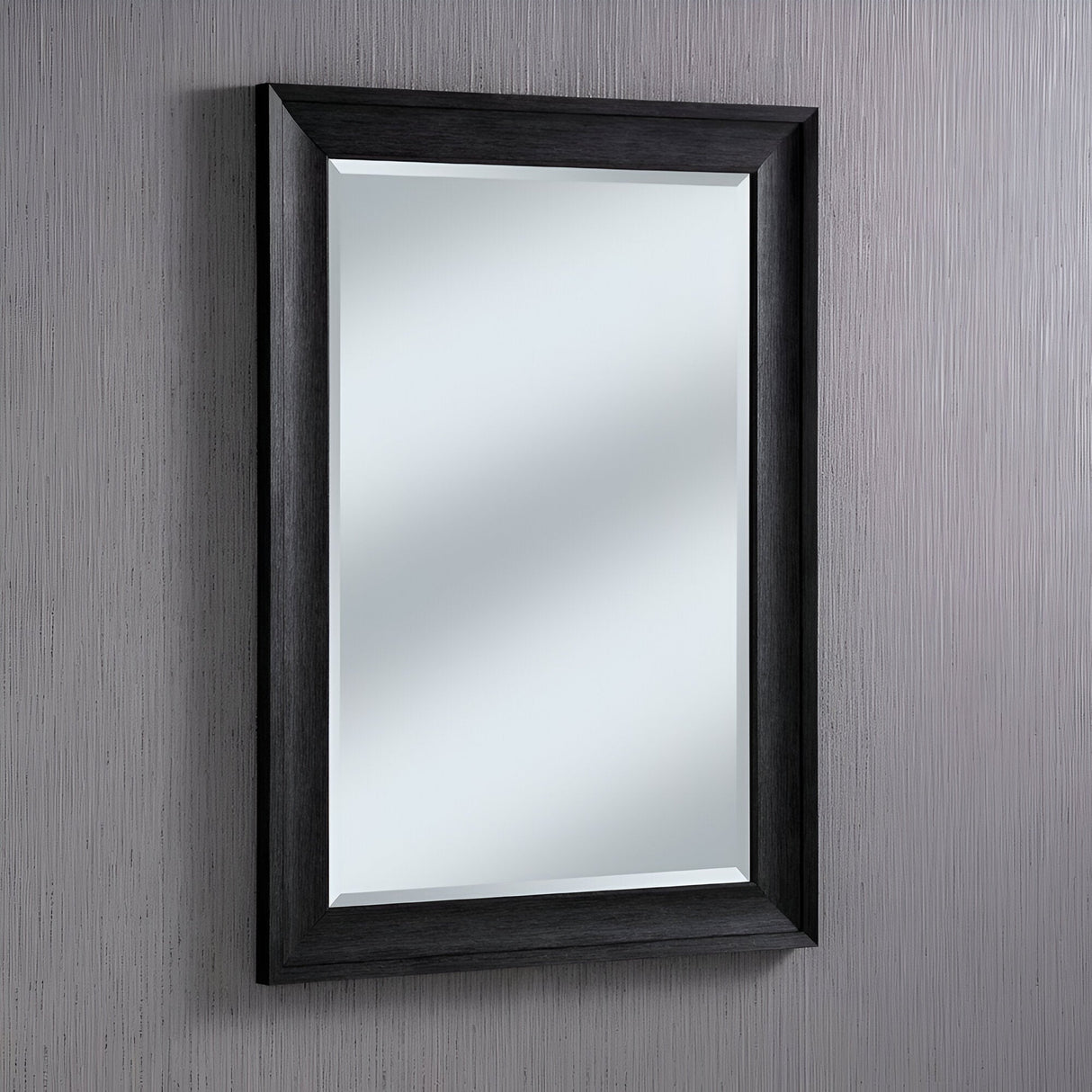 The Liberty Rectangle Wall Mirror - Dark Grey exudes modern sophistication with its dark grey frame, elegantly poised on a textured gray wall.