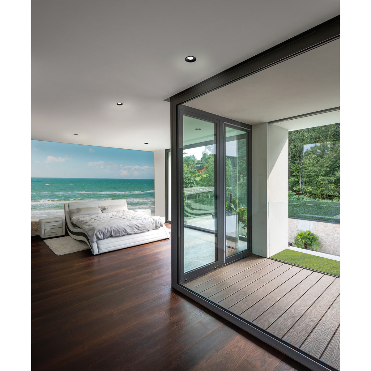 Lamborjini GU10 round spotlight, 93mm black recessed downlight, shown ceiling-mounted in a modern bedroom with glass doors opening onto a terrace.