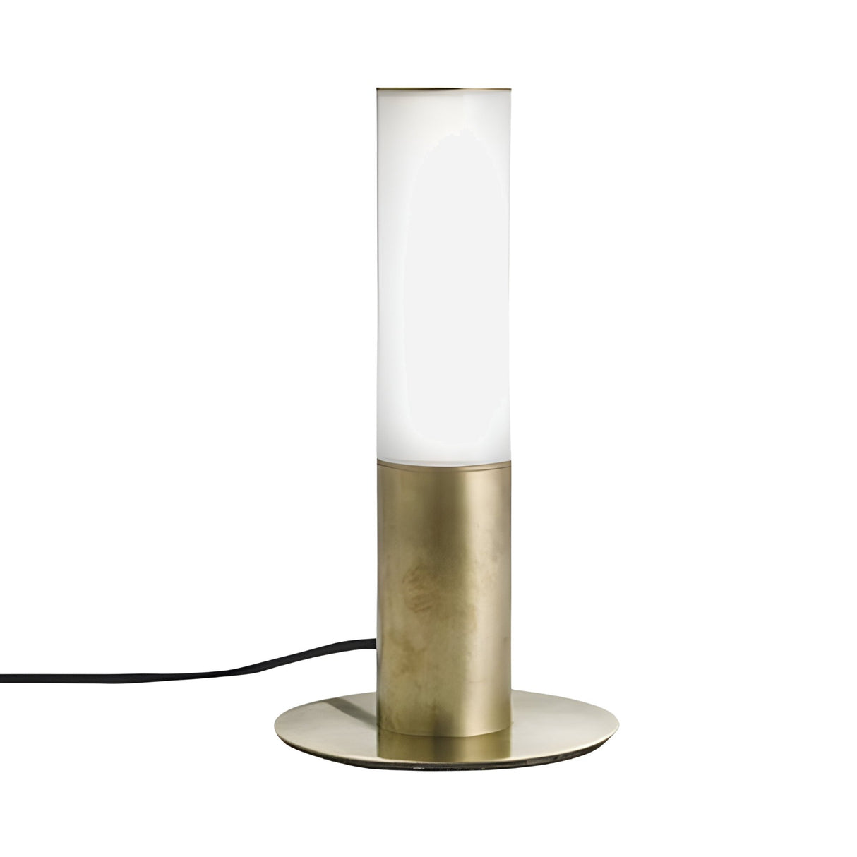 The Magari Table Lamp - Gold features a cylindrical white opal shade, a brushed gold base set on a round metal plate, and a black power cord extending from the base.
