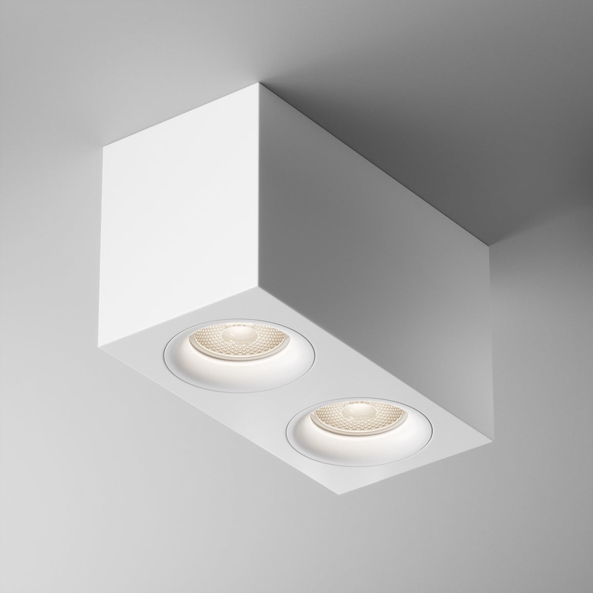 Ceiling-mounted minimalist design: the Slim Twin Flat Rectangular Surface Downlight in white features two recessed circular LED lights crafted from premium aluminum.