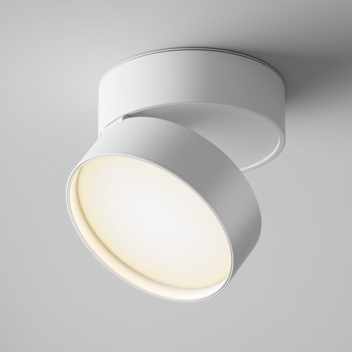 The Onda LED Single Spotlight 18W 3000K in white boasts a sleek, modern cylindrical design with an adjustable head to softly emit warm light against the white background.