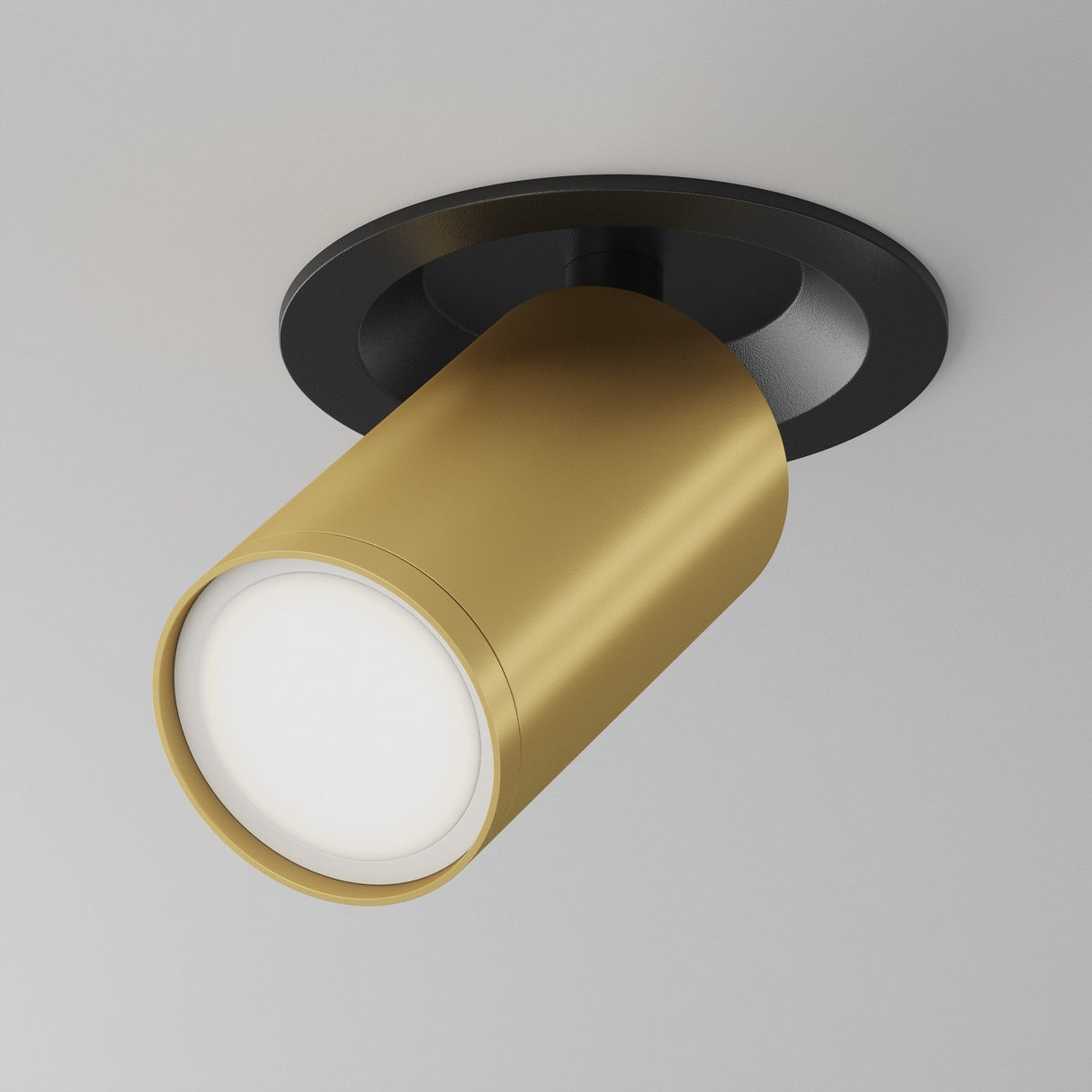 The Focus S Single Recessed Spotlight features a sleek black and matte gold cylindrical design with a circular black mounting plate on a white ceiling. It offers versatile illumination with its 360° swivel mechanism.