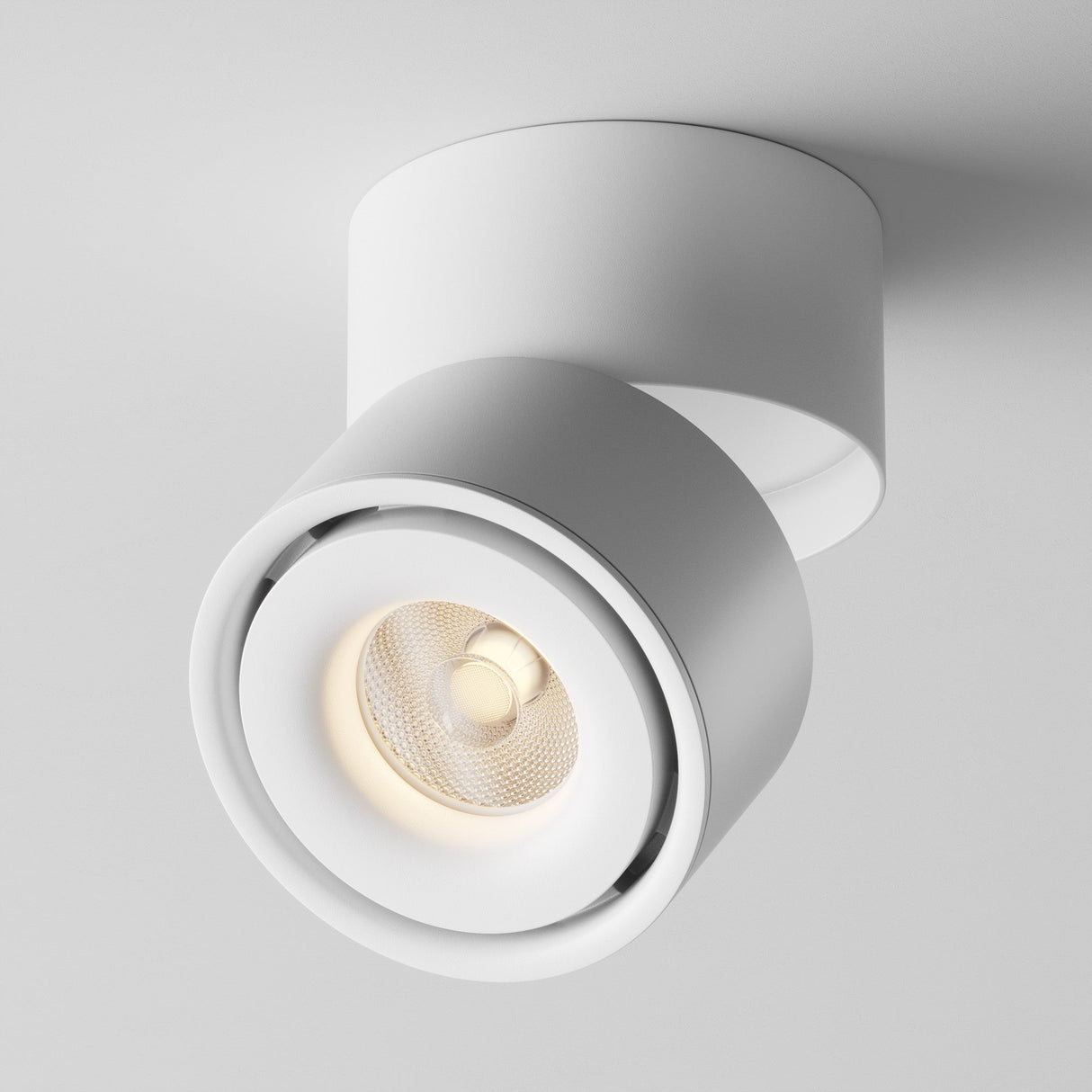 The image shows the Yin LED Single Spotlight, a sleek white cylindrical ceiling light with a 15W LED bulb. Angled downward, it emits a warm glow with a CRI of 90, ideal for contemporary interiors.