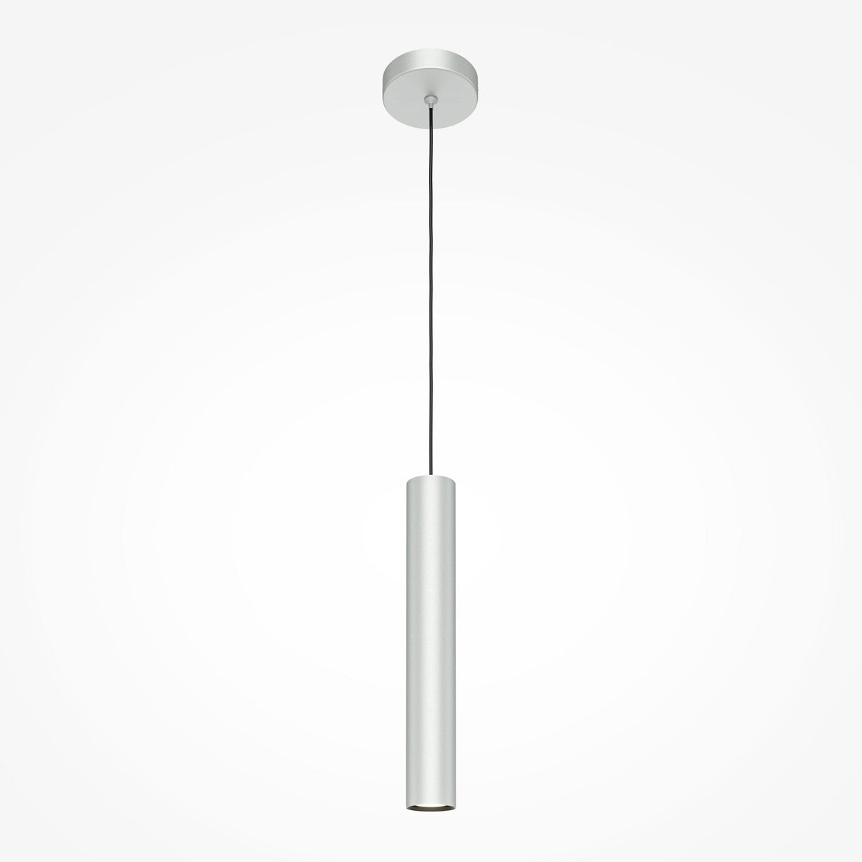 The Pro Focus Thin Pendant Light - Silver features a sleek, minimalist cylindrical design, suspended by a thin black cord from a round ceiling mount. With its polished silver finish, it embodies modern design against a plain white backdrop.