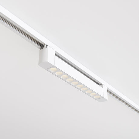 The Points Rot LED Swivel Linear Track Light for Single Phase Track Unity 10W 3000K 36°- White is a rectangular ceiling fixture with multiple light sources along a silver track, boasting a high color rendering index and creating a modern look against the white ceiling.