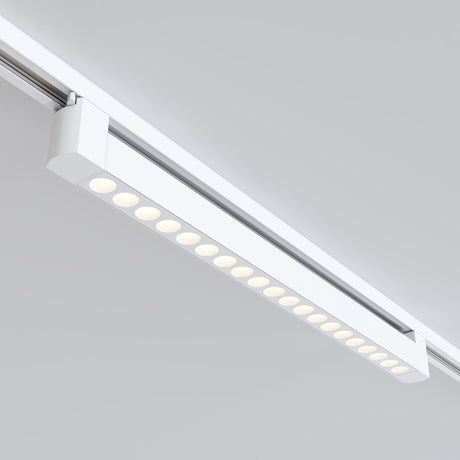 The Points Rot LED Swivel Linear Track Light for Single Phase Track Unity (20W, 3000K, 36°) offers modern elegance with warm white lighting. Its rectangular design has clean lines and a minimalist look, standing out elegantly against light gray ceilings.