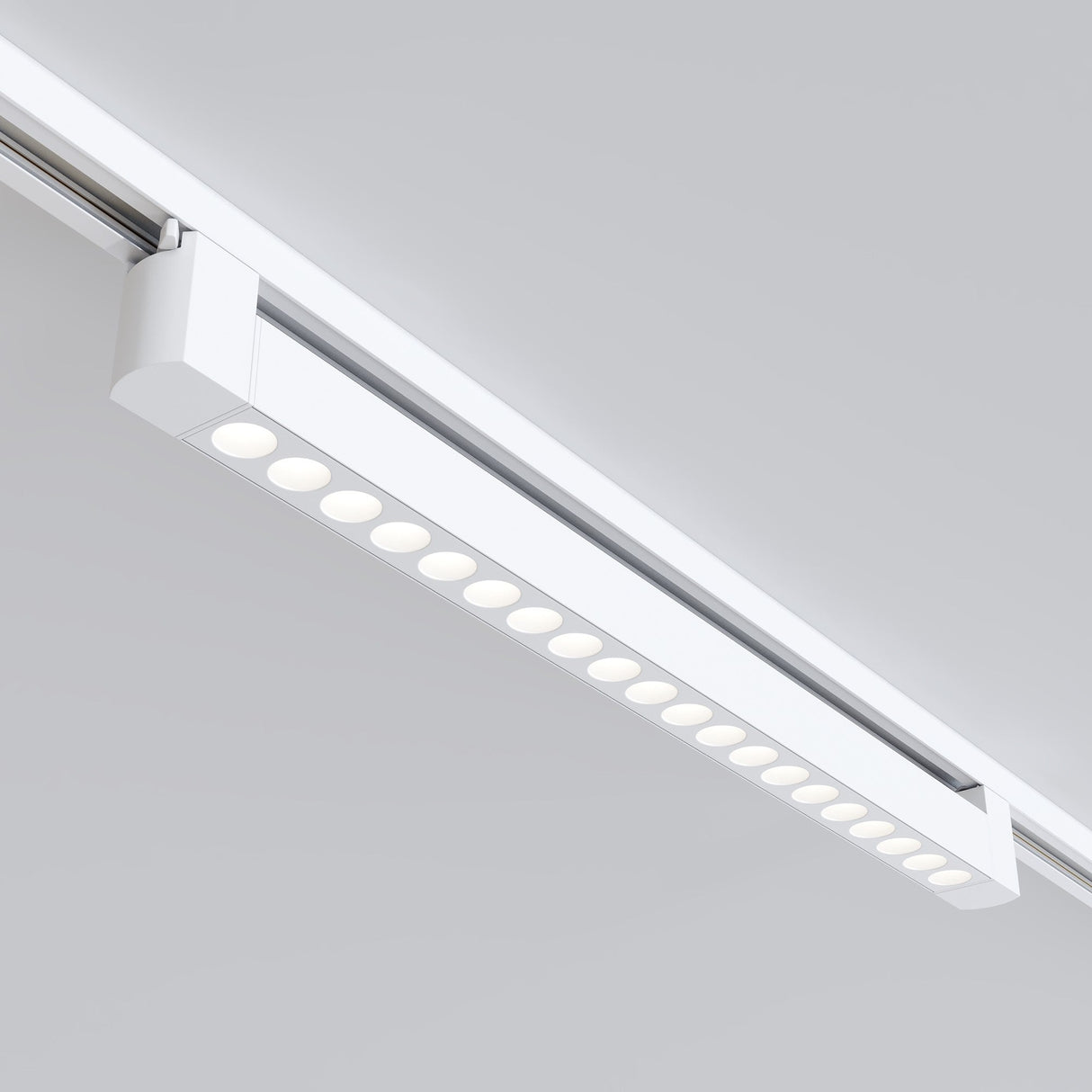 The Points Rot LED Swivel Linear Track Light in white offers a minimalist design with a 20W output and 4000K lighting brilliance, featuring multiple small round bulbs on a white ceiling rail for single-phase track unity.
