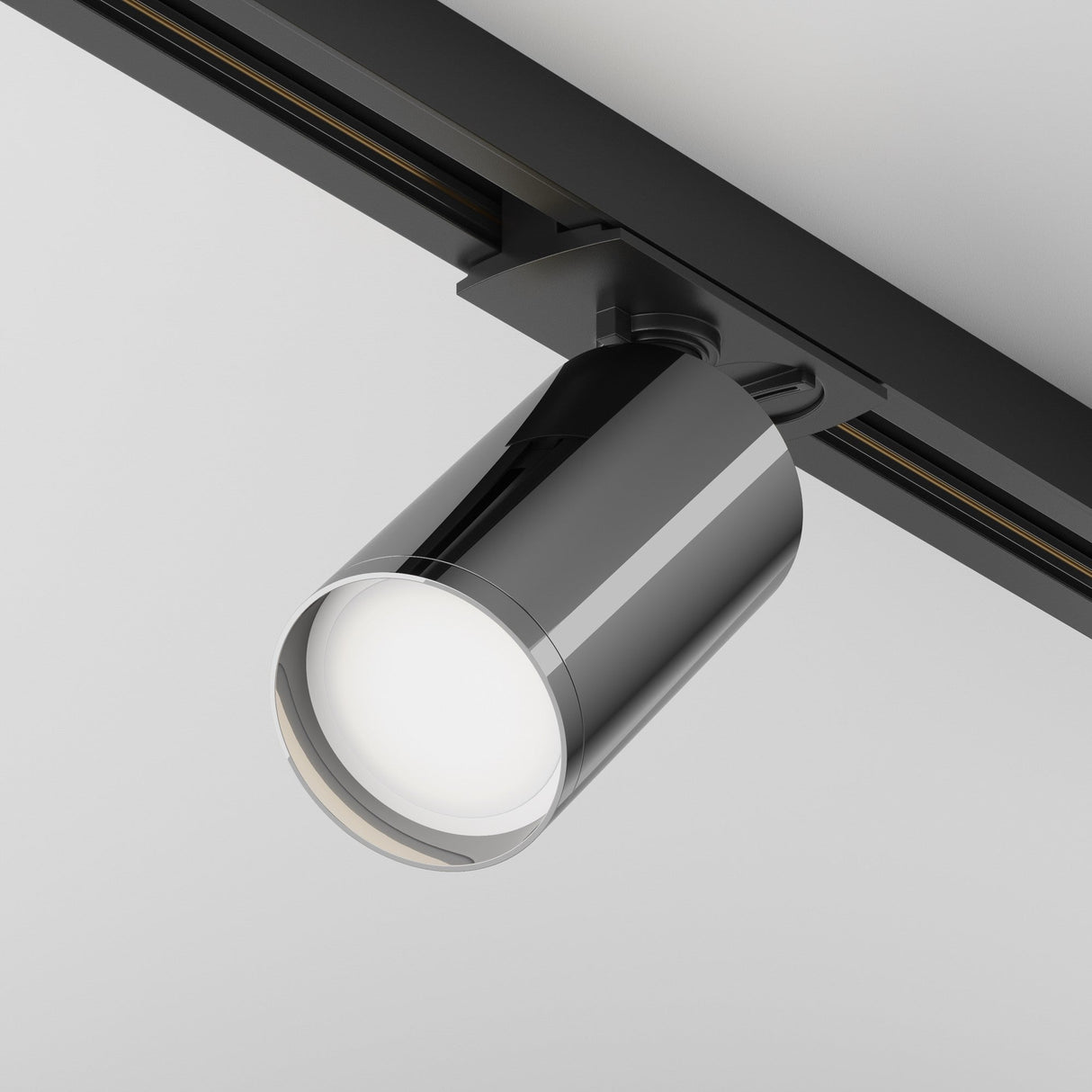 Focus S single phase Unity track spotlight in black and graphite, shown in an interior, enhancing contemporary spaces.