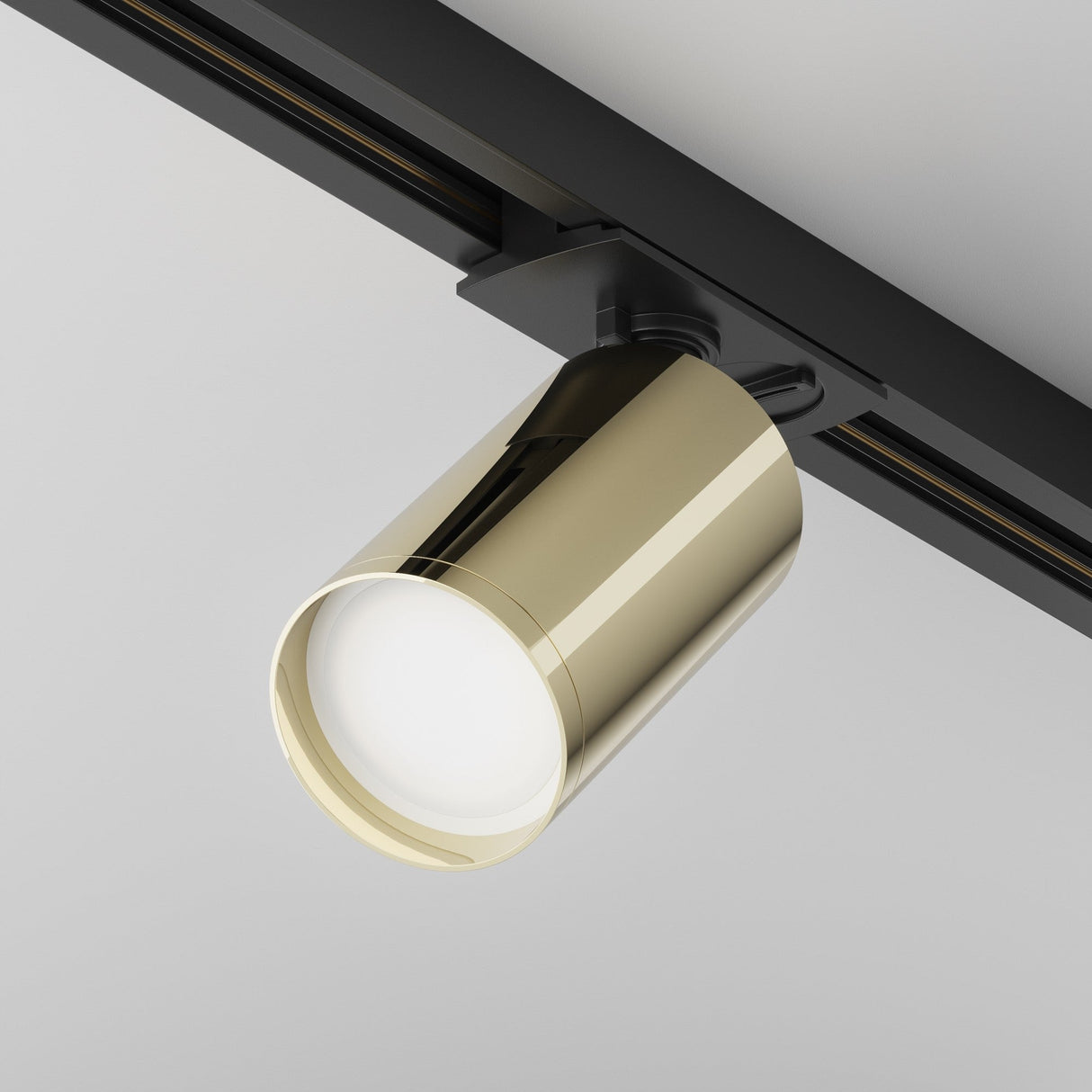 Focus S single phase Unity track spotlight in black and gold, highlighted in a modern interior setting.