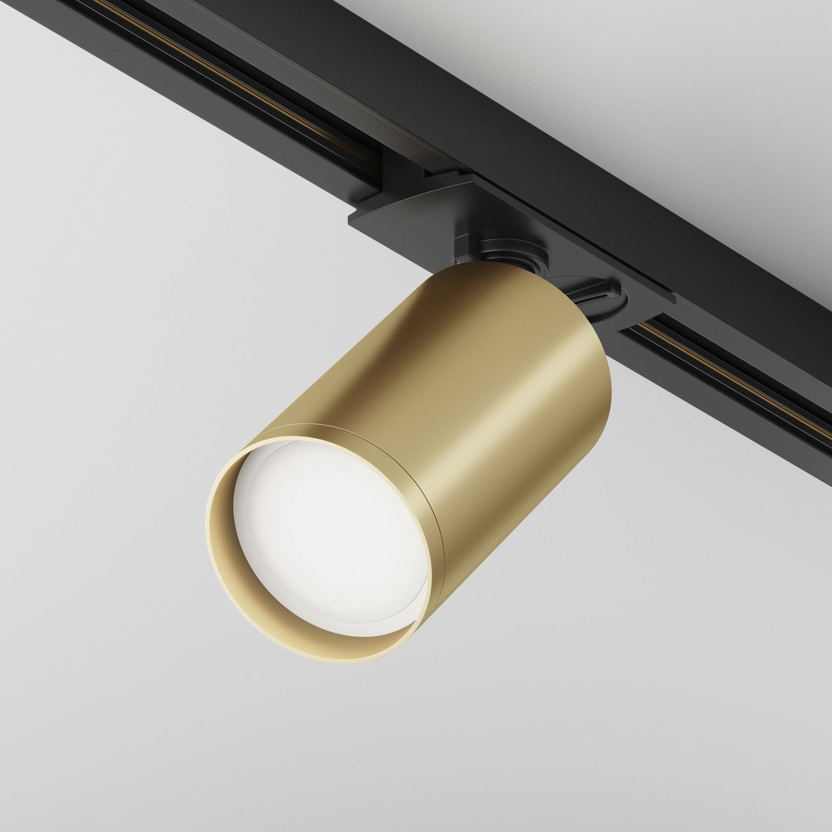 Focus S single phase Unity track spotlight in black and matte gold, enhancing interiors with its elegant design.