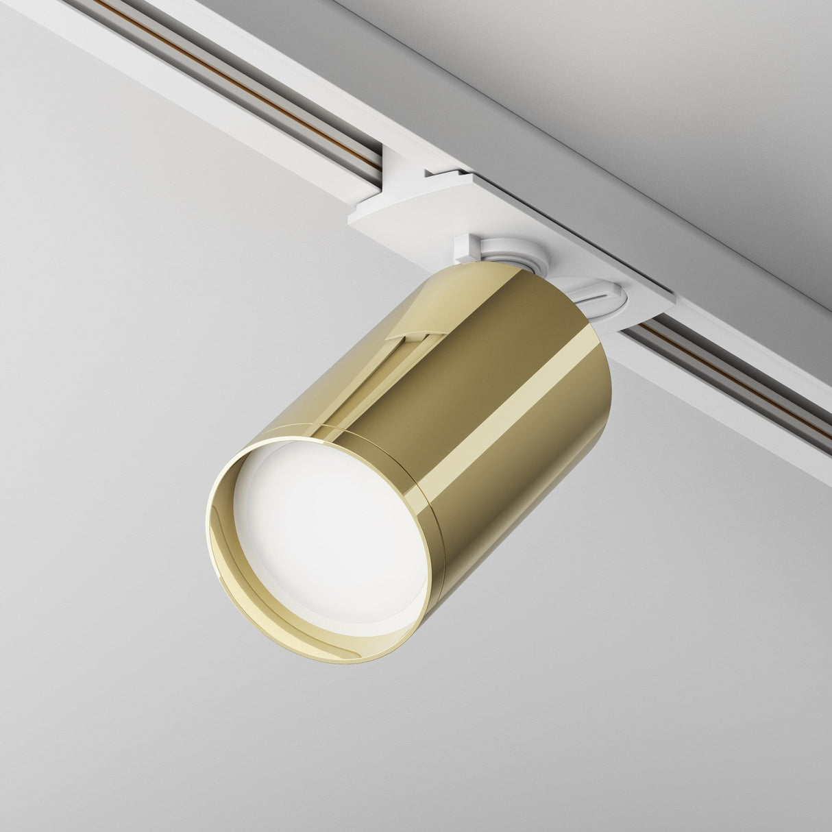 Focus S single phase Unity track spotlight in white and gold, displayed in a modern room setting.