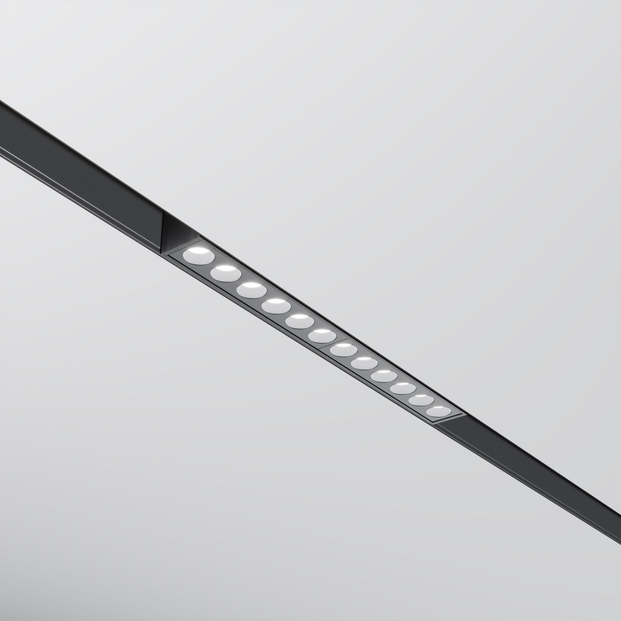 The Points LED Linear Track Light (12W, 3000K) features a black frame with evenly spaced circular LEDs against a light gray background. It integrates seamlessly with Magnetic Exility systems for adaptable lighting solutions.