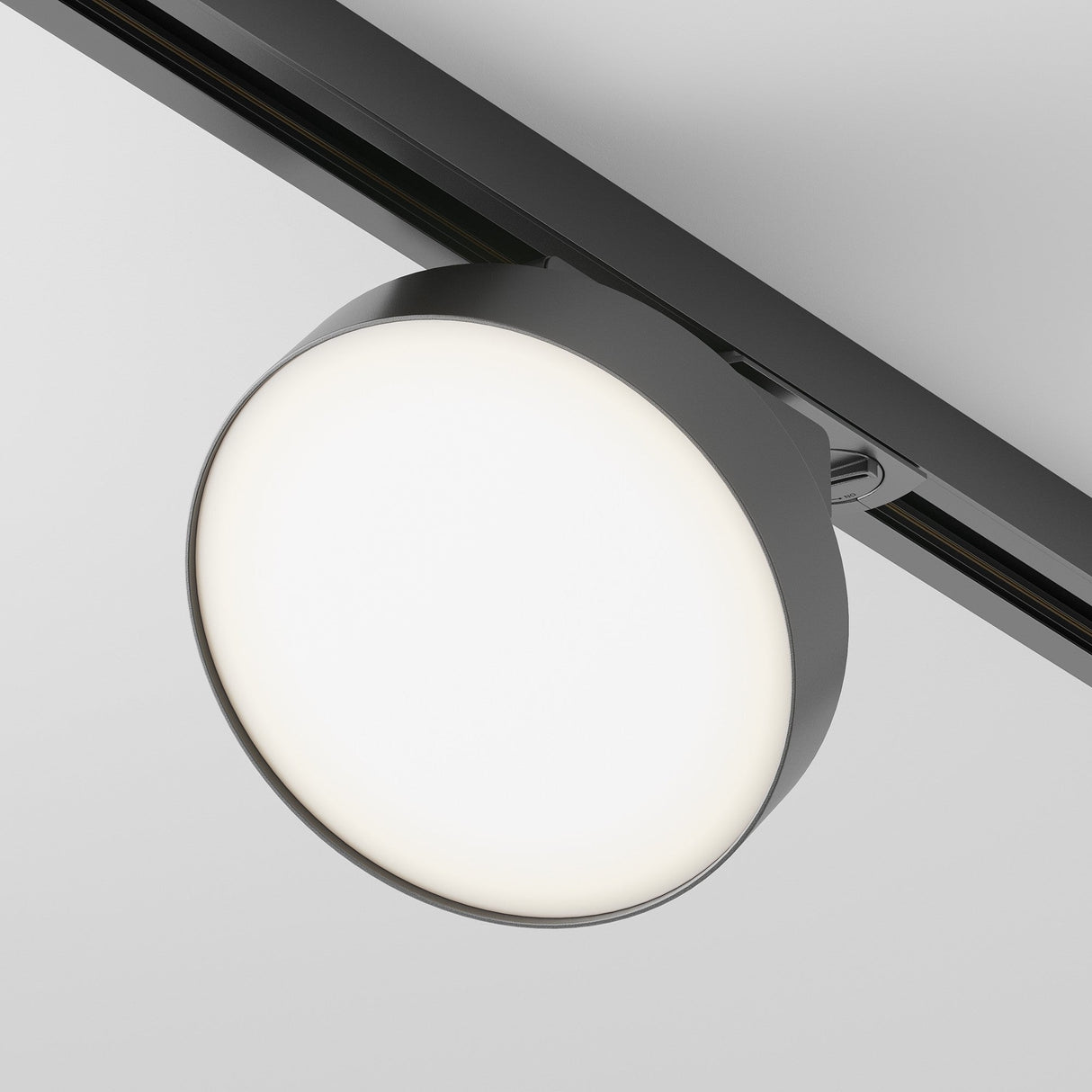 The Zon LED Single Phase Unity Track Spotlight 12W 4000K - Black is a sleek and modern lighting fixture that casts soft, even illumination with its adaptable design.