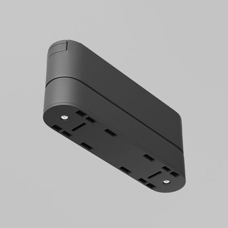 The Radity Magnetic Track Short Adaptor - Black, with its sleek, modern design, is shown in a wall-mounted view from a slightly lower angle against a plain gray background, featuring subtle customizable lighting.